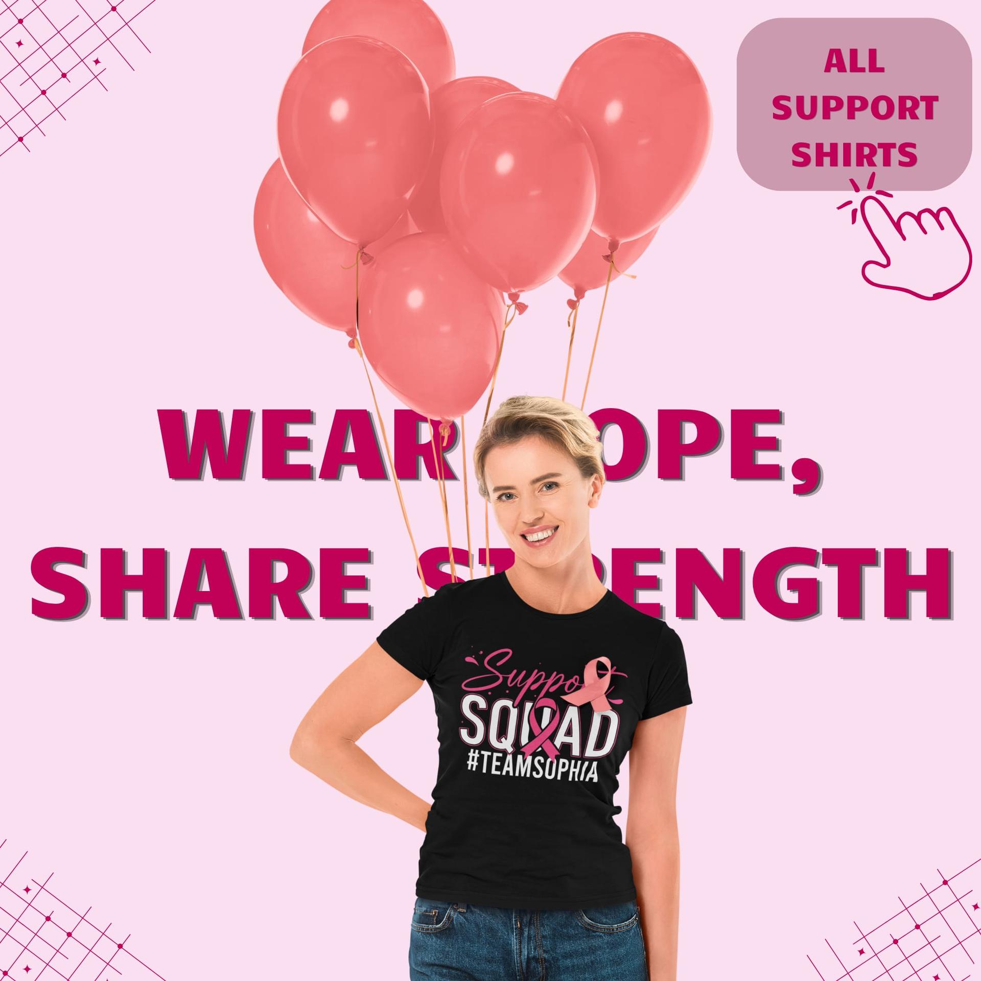 A woman in a pink-ribbon Support Squad shirt beside pink balloons